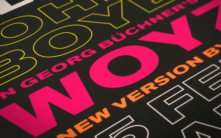 Brightly coloured text on a dark brown background
