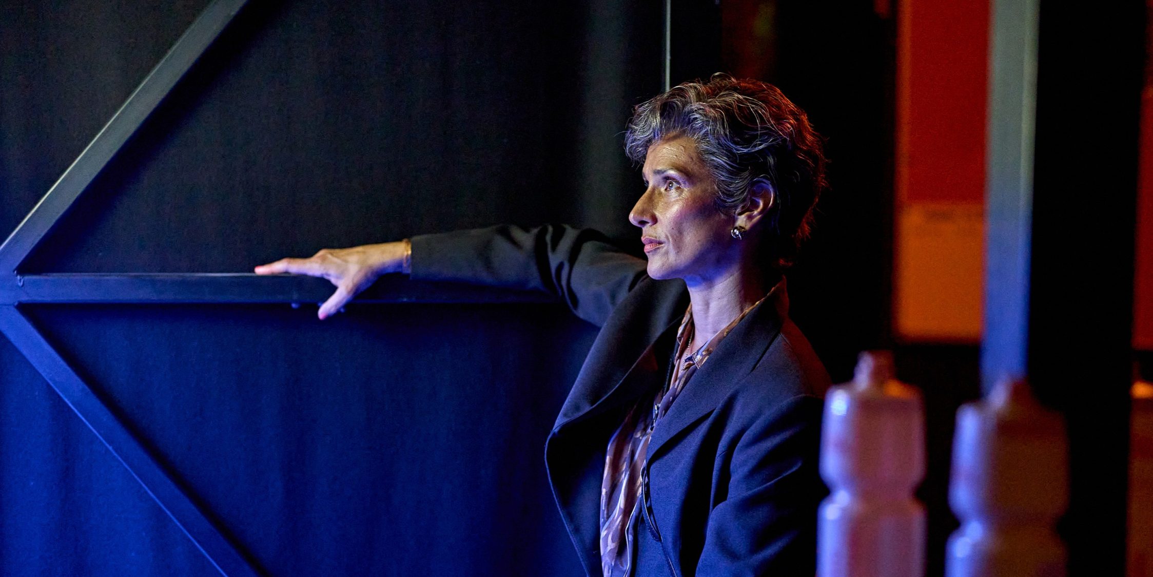 Indira Varma waits in the wings as the prepares for her entrance to the stage.
